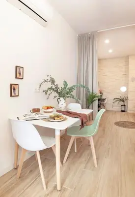 a white dining room with a table and chairs at RB - Urban loft retreat, comfort & good location in Valencia