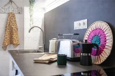 a kitchen counter with a toaster and a sink at RB - Urban loft retreat, comfort & good location in Valencia