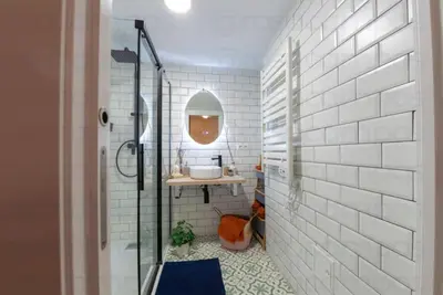 a bathroom with a sink and a glass shower at RB - Urban loft retreat, comfort & good location in Valencia