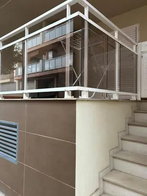 a balcony on the side of a building with stairs at Wohnung in Chilches in Xilxes