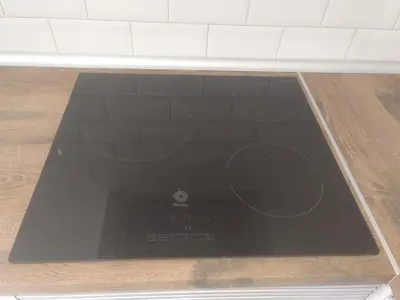 a stove top oven sitting on top of a kitchen floor at Apartamento moderno de 70 metros a 300 metros de la playa in Valencia