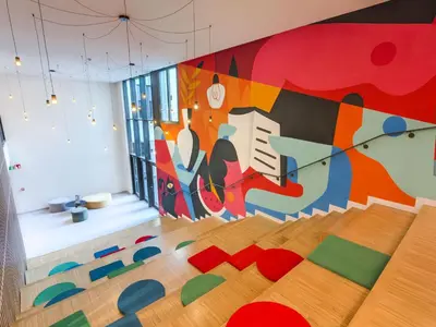 a room with a colorful mural on the wall at Livensa Living Studios Valencia Viveros Hotel - Apartamento in Valencia