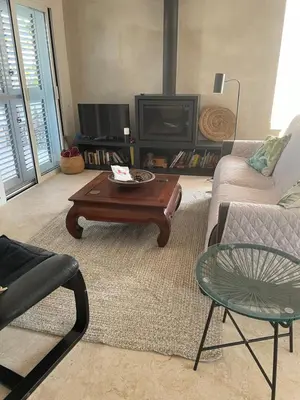 a living room with a couch and a coffee table at Chalet Las Brisas in Cullera