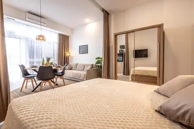 a bedroom with a bed and a dining room at Increíble Loft junto a la ciudad de las ciencias in Valencia