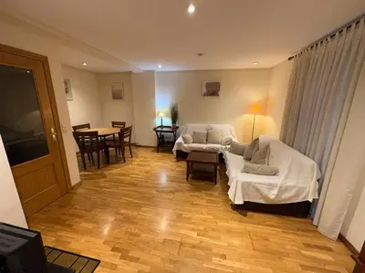 a living room with two beds and a table at Apartamento Almas Centro in Valencia