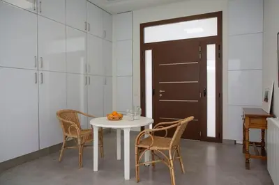 a dining room with a white table and chairs at SingularStays Picaña in Picanya