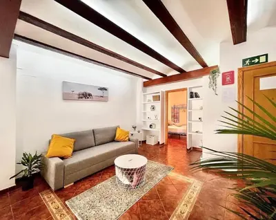 a living room with a couch and a table at Apartamento con Terraza cerca de la Estación del Nord in Valencia