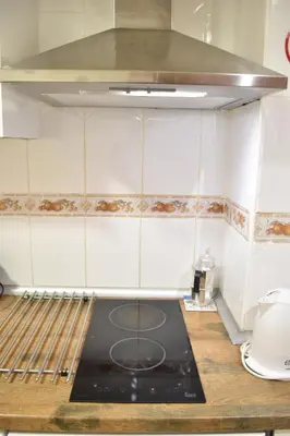 a kitchen with a stove top oven in a kitchen at Estudio con encanto en el casco antiguo de Valencia in Valencia