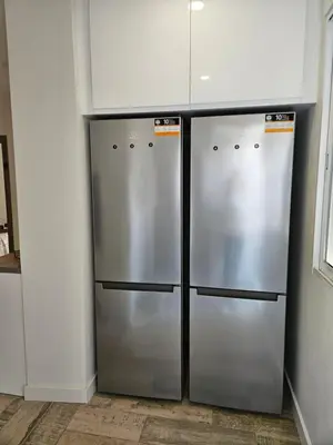 two stainless steel refrigerators are in a kitchen at Habitación céntrica de Lujo Gv 1 in Valencia