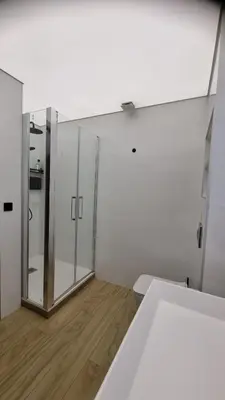 a room with a glass door and a wooden floor at Habitación céntrica de Lujo Gv 4 in Valencia