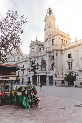 a large building with a clock tower in front of it at Habitación céntrica de Lujo Gv 2 in Valencia
