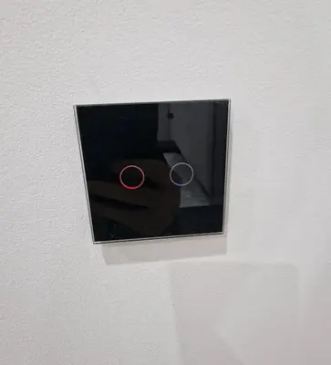 a couple of rings in a lightswitch on a wall at Loft independiente de Lujo. in Valencia