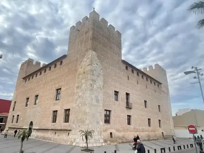 a large building with a tower on top of it at Apartamento El Castell in Alaquas