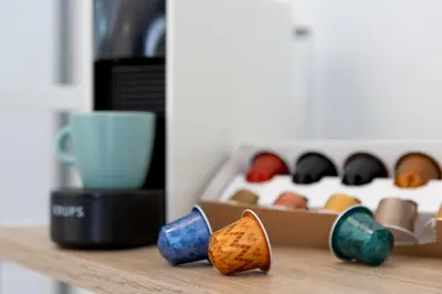 a shelf with a box filled with different colored bowls at Lore Loft Valencia in Valencia