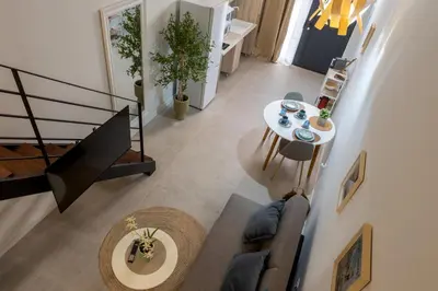 an overhead view of a living room with a table and chairs at Lore Loft Valencia in Valencia