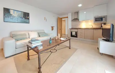 a living room with a couch and a table at Awesome Apartment In Moncofa in Moncófar