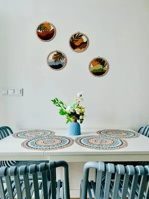 a dining room table with plates on the wall at Beautiful Flat NEXT the BEACH in Valencia