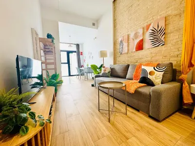 a living room with a couch and a table at Beautiful Flat NEXT the BEACH in Valencia
