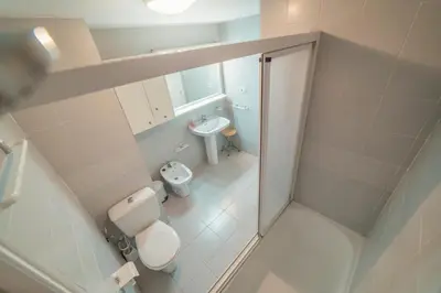 an overhead view of a bathroom with a toilet and sink at Apartamento familiar Port-Saplaya in Port Saplaya