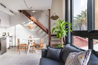 a living room with a couch and a table at Valencia Apartments by Olala Homes in Valencia