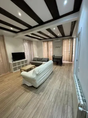 a living room with a white couch and a table at Mercado CENTRAL on 1th FLOOR in Valencia