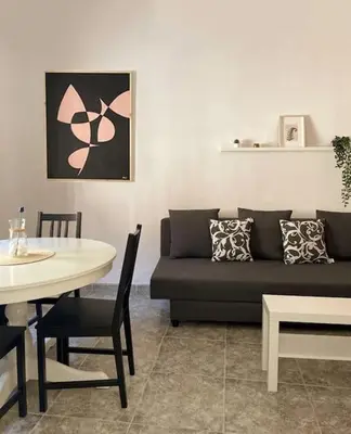 a living room with a couch and a table at Casa Lola - Con 2 terrazas, ideal para desconectar in Requena