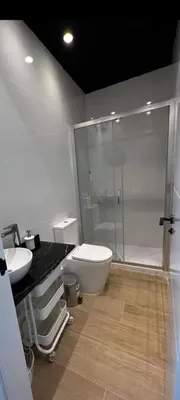 a bathroom with a shower and a toilet and a sink at Beach Valencia Rooms Late Checkout 14 h free Netflix Tv in Valencia