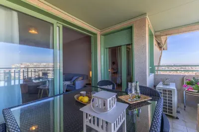 a room with a balcony with a table and chairs at SAPORE DI MARE in Valencia