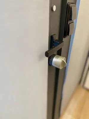 a close up of a door with a metal latch at BatFlats - RUZAFA in Valencia