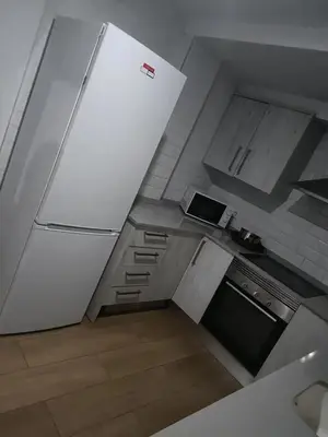 an overhead view of a kitchen with a refrigerator at habitaciones patraix in Valencia