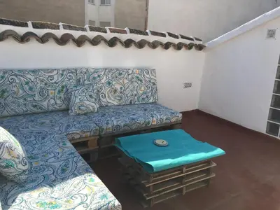 a living room with a couch and a table at Pericos Gilet in Gilet