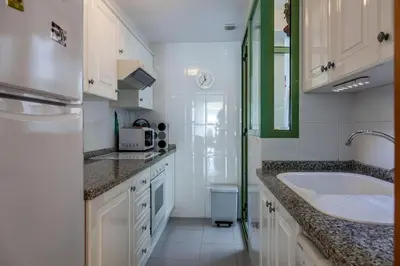 a white bathroom with a sink and a tub at Valencia Flat Rental Patacona Beach in Valencia