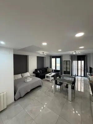 a bedroom with a bed and a living room at Valencia Old Town Suite in Valencia