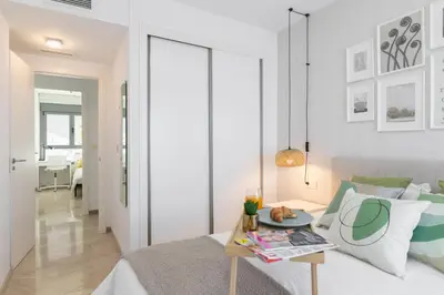 a living room with a bed and a table at DormForYou Jose Maria Haro in Valencia