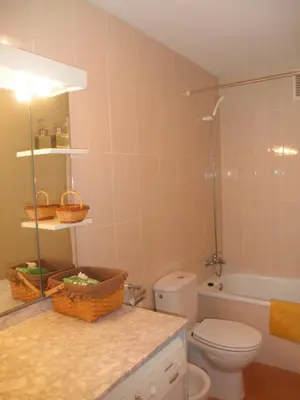 a bathroom with a toilet and a sink and a shower at Canet estival in Canet de Berenguer