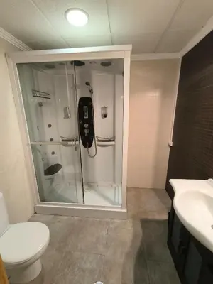 a bathroom with a shower and a toilet and a sink at Ca' La Conchin in Cortez de Pallas