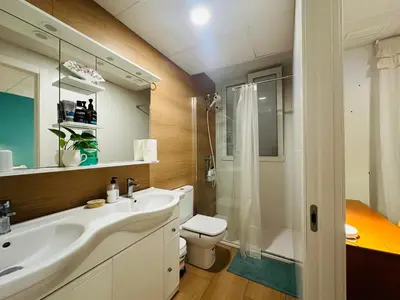 a bathroom with a sink and a toilet and a shower at Mirador 1 del Mercado Central - habitacion con baño privado en el centro de la Ciudad Vella in Valencia