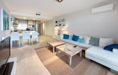 a living room with a couch and a table at 2 Bedroom Awesome Apartment In Moncofa in Moncófar