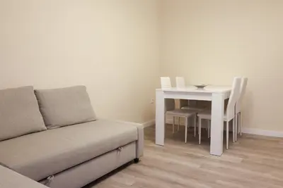 a living room with a couch and a table at Non Stress Nuevo Turia in Valencia