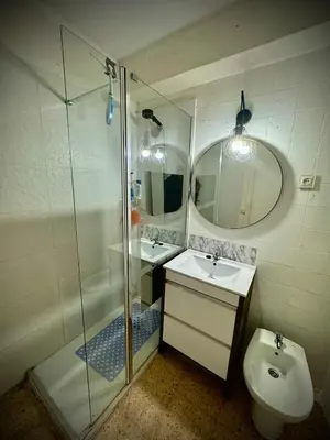 a bathroom with a shower and a sink and a toilet at Habitación en la playa in Valencia