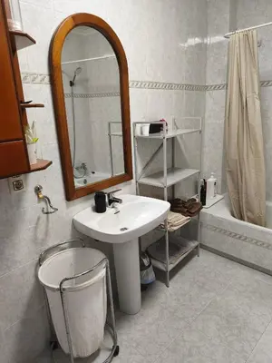 a bathroom with a sink and a mirror and a tub at CA ÁNGEL in Anna