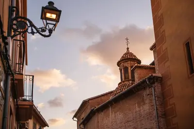 a building with a church steeple and a cross on top at Cozy Up Spain in Valencia