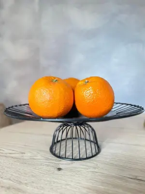 a group of oranges on a plate on a table at Cozy Up Spain in Valencia