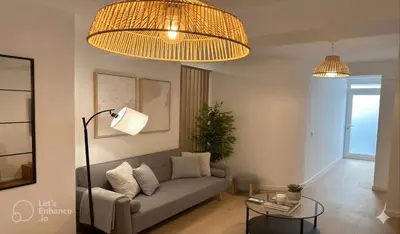 a living room with a couch and a glass table at Dulces Sueños Amistad in Valencia