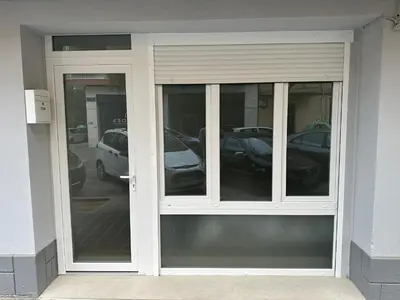 a revolving door with cars in a parking lot at Dulces Sueños Amistad in Valencia