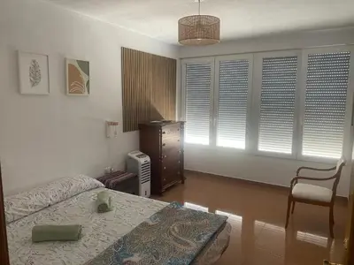 a room with two chairs and a view of the beach at Primera línea de playa in Valencia
