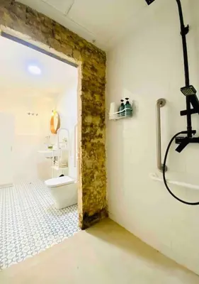 a bathroom with a shower and a toilet in a room at Beautiful LOFT in the HEART of Ruzafa, SOHO in Valencia