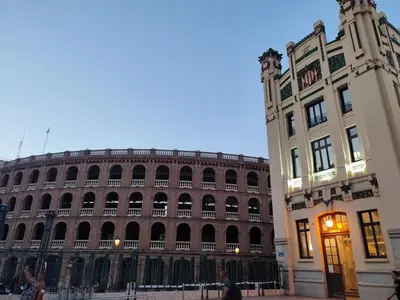 a large building next to a tall building at Central Rooms - Valencia City Centre Boho-Cozy Downtown - VLC Urban Rental in Valencia