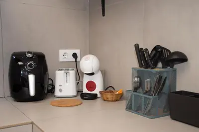 a kitchen counter with a blender and other kitchen utensils at lifecoliving valencia loft A in Valencia