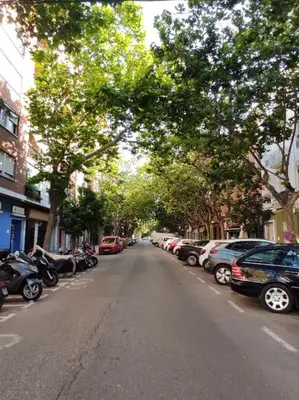 a street with cars parked on the side of a street at lifecoliving valencia loft A in Valencia